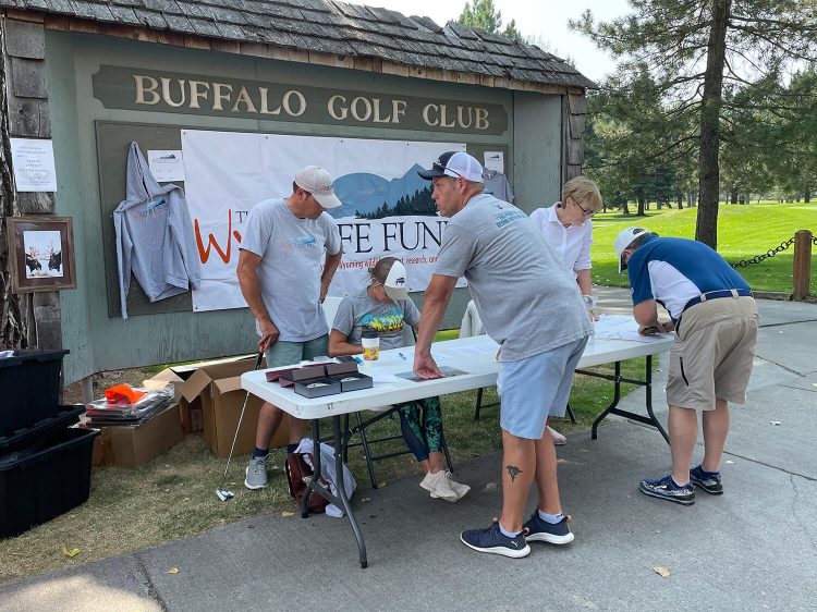 The WYldlife Fund booth at the Golf for Wildlife Tournament in Buffalo, Wyoming